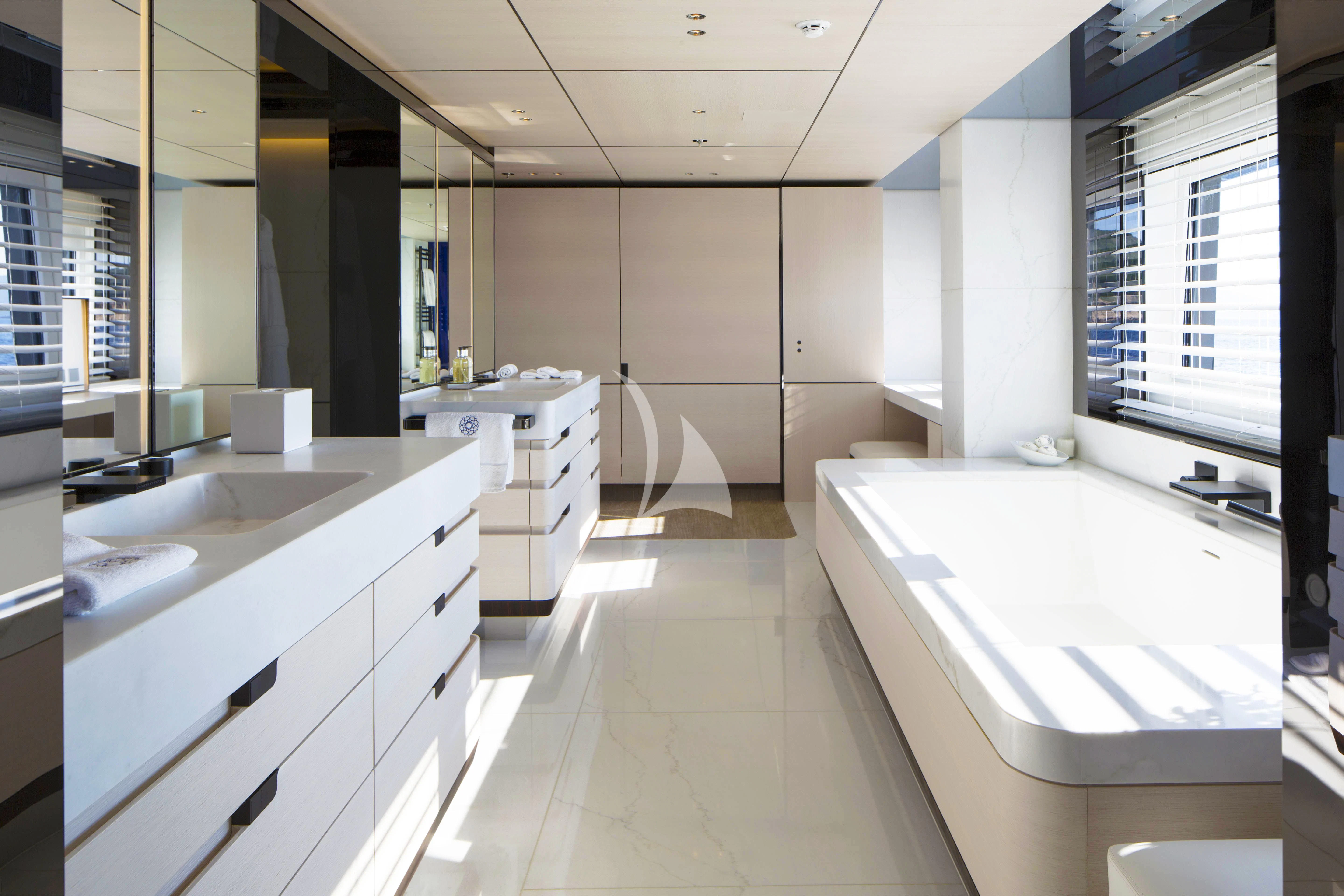 a bathroom with sinks and cabinets aboard KAMALAYA Yacht for Sale