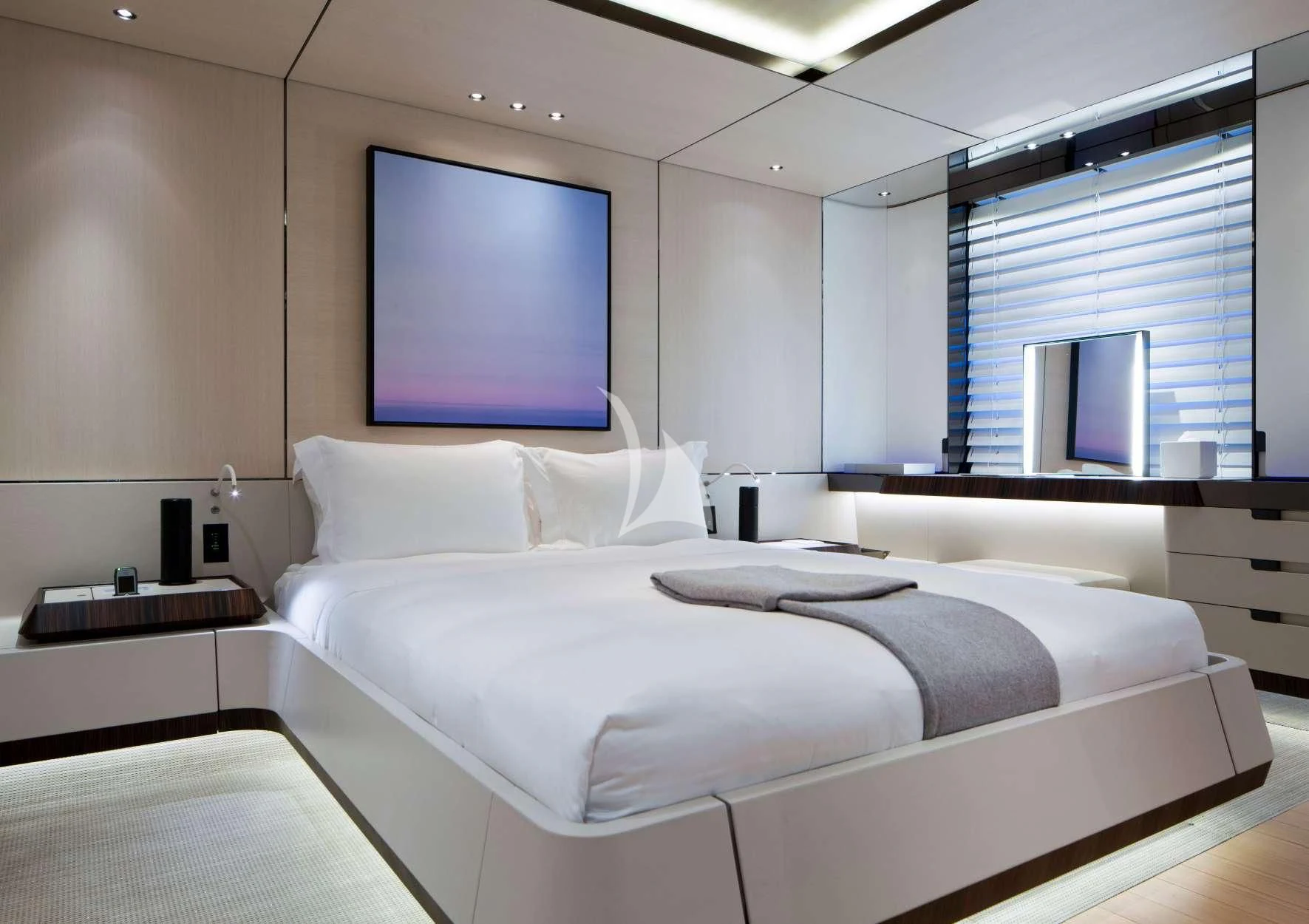 a bed with a white sheet aboard KAMALAYA Yacht for Sale