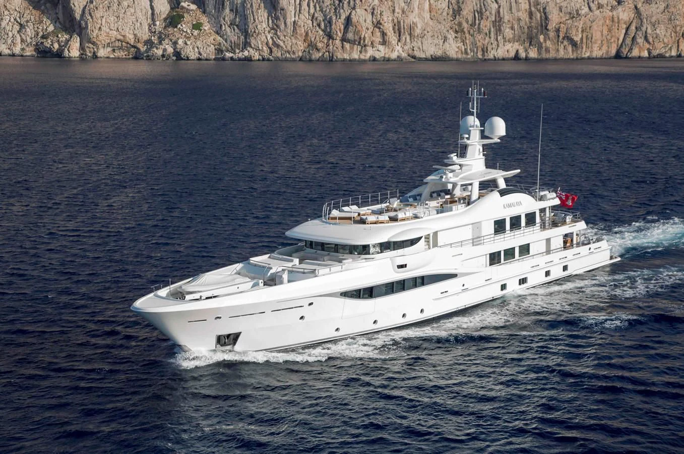 a white boat on the water aboard KAMALAYA Yacht for Sale