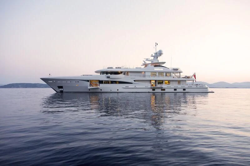 a large white ship in the water aboard KAMALAYA Yacht for Sale