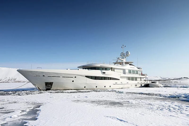 a white boat in the snow aboard KAMALAYA Yacht for Sale
