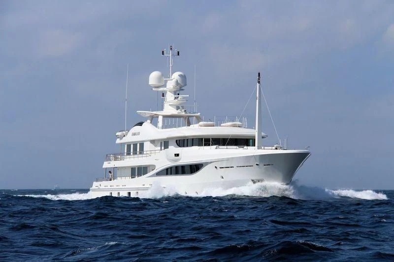 a white boat in the water aboard KAMALAYA Yacht for Sale