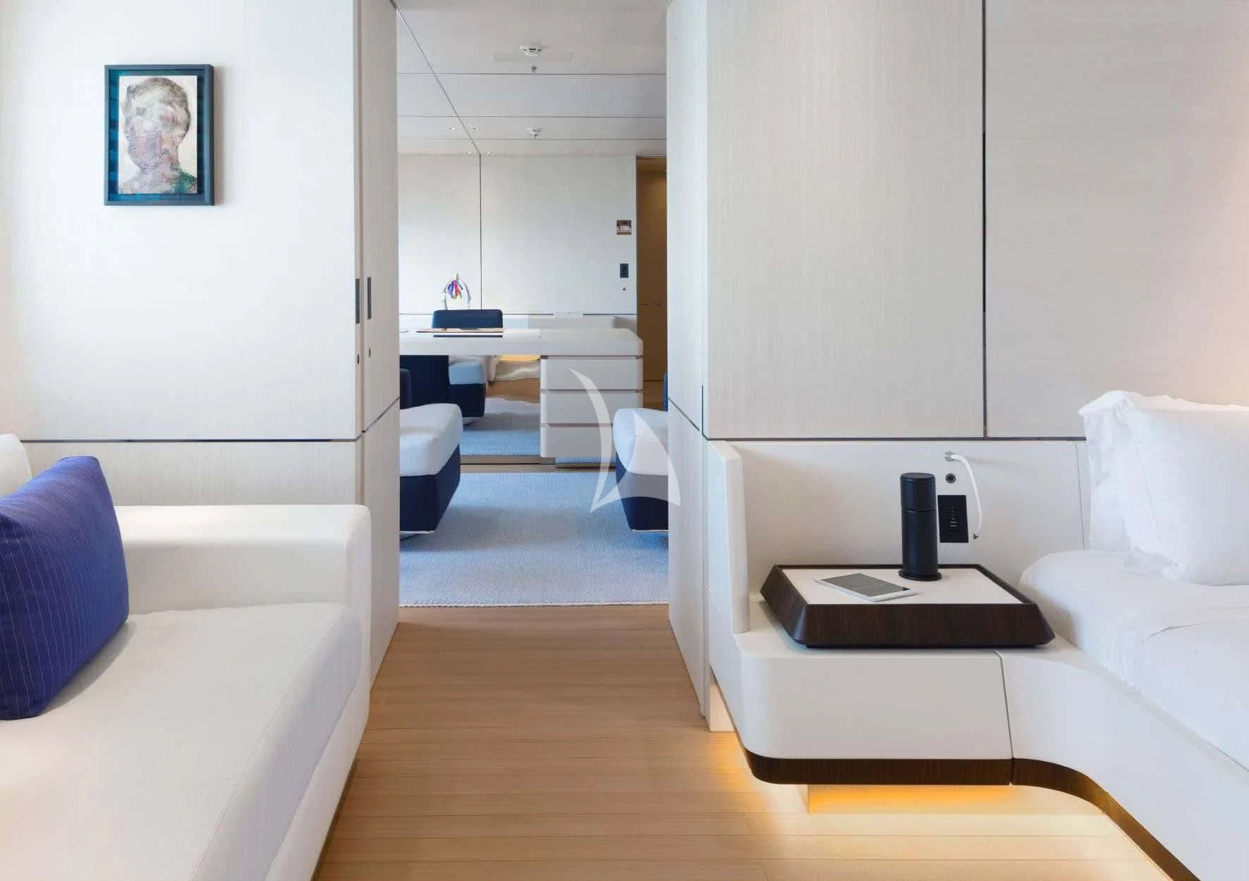 a room with a bed and a desk aboard KAMALAYA Yacht for Sale