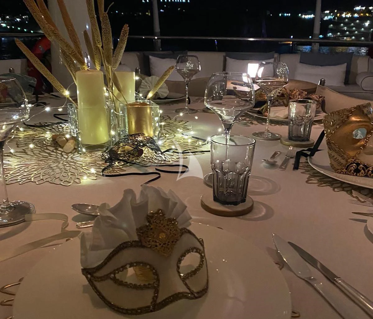 a table with glasses and food aboard KAMALAYA Yacht for Sale