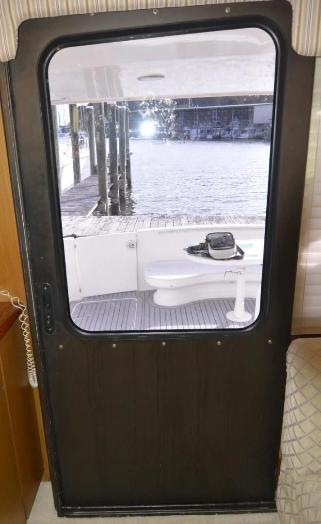 a bathroom with a sink and a mirror aboard DOG HOUSE Yacht for Sale