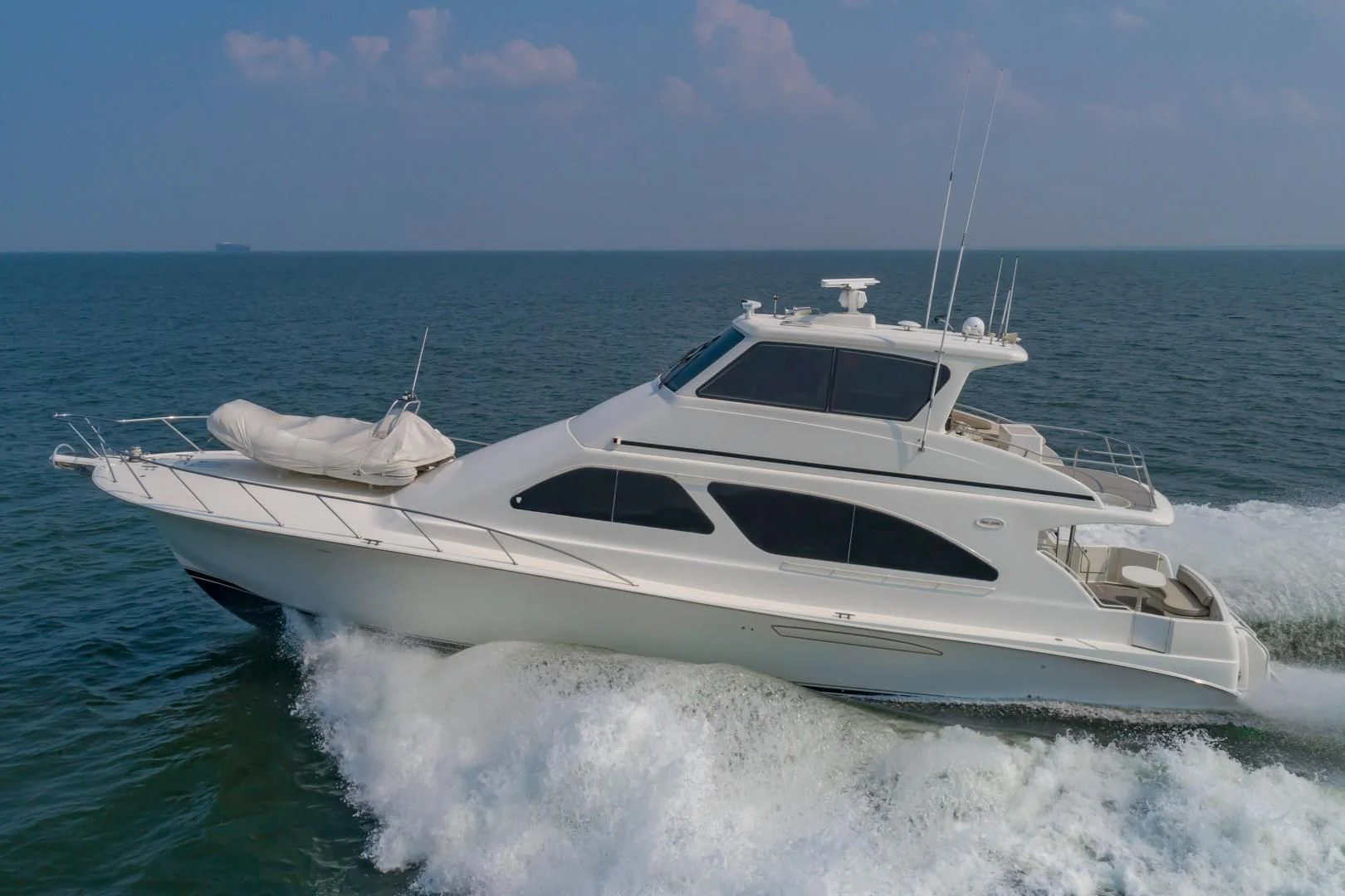 a white yacht on the water aboard DOG HOUSE Yacht for Sale
