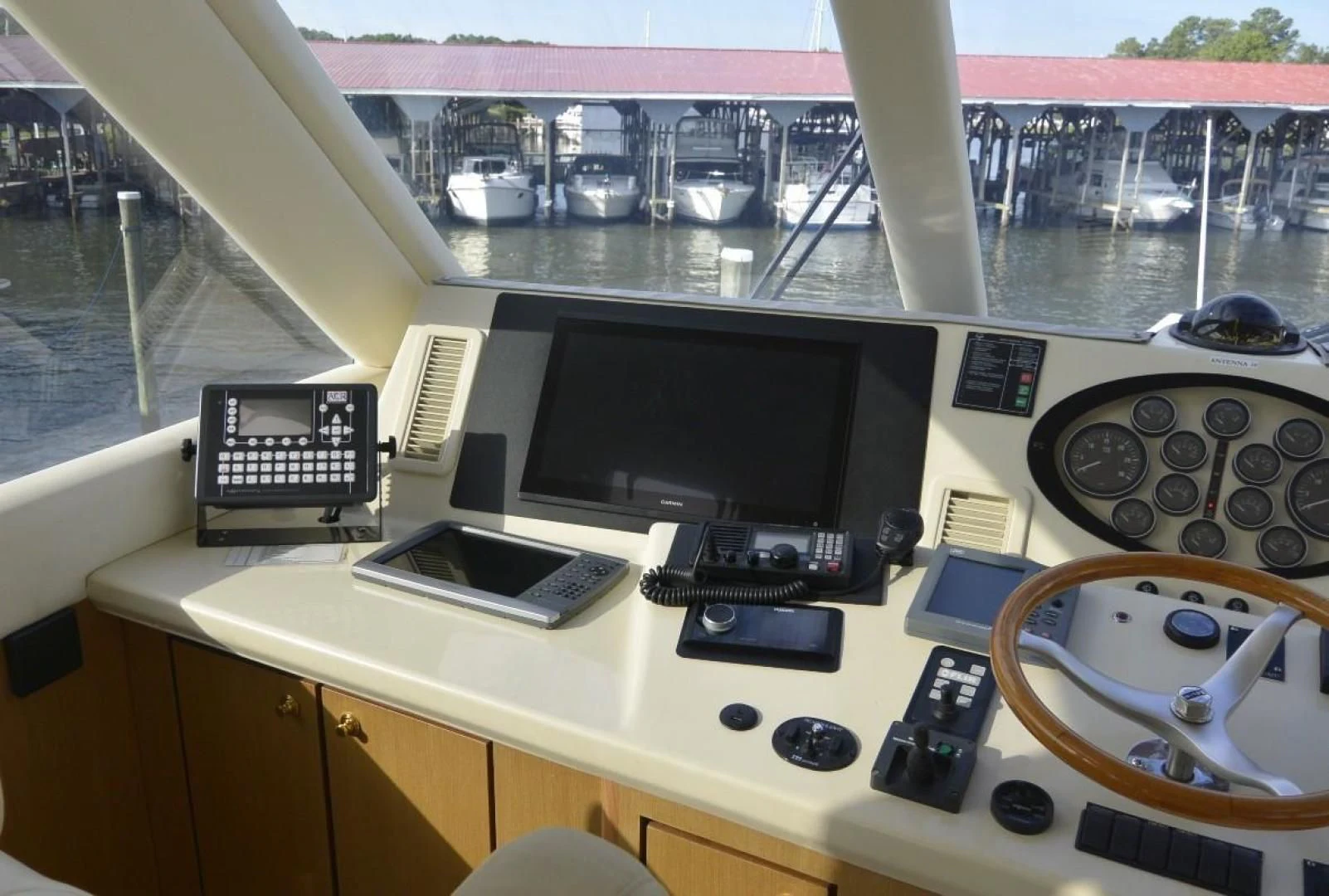 a desk with a computer and other electronics on it aboard DOG HOUSE Yacht for Sale