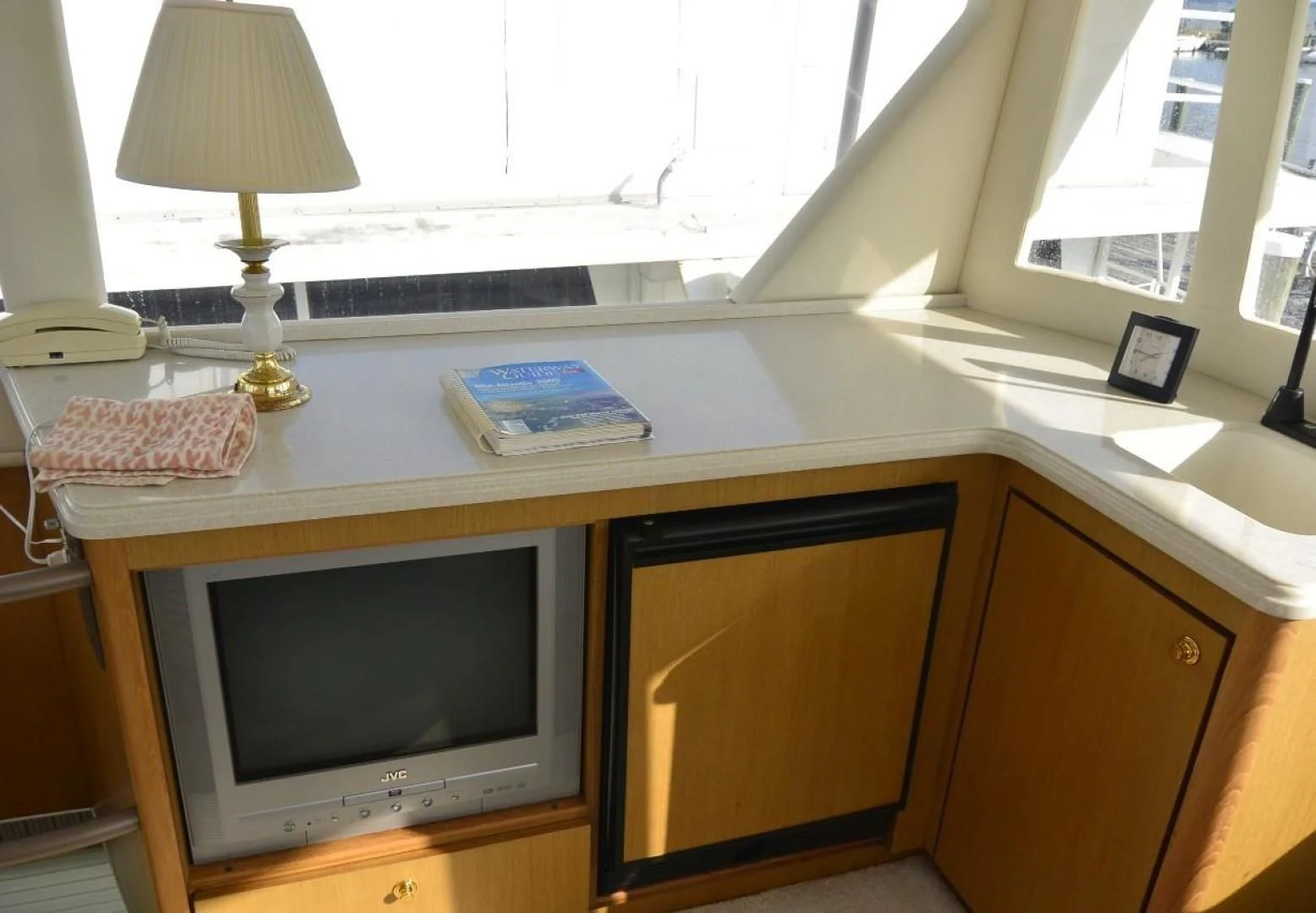 a tv on a desk aboard DOG HOUSE Yacht for Sale