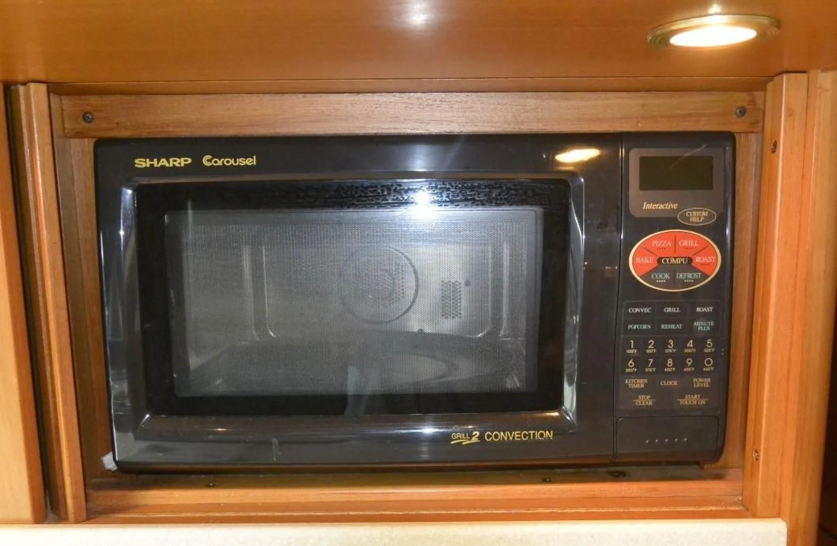 a microwave oven on a shelf aboard DOG HOUSE Yacht for Sale