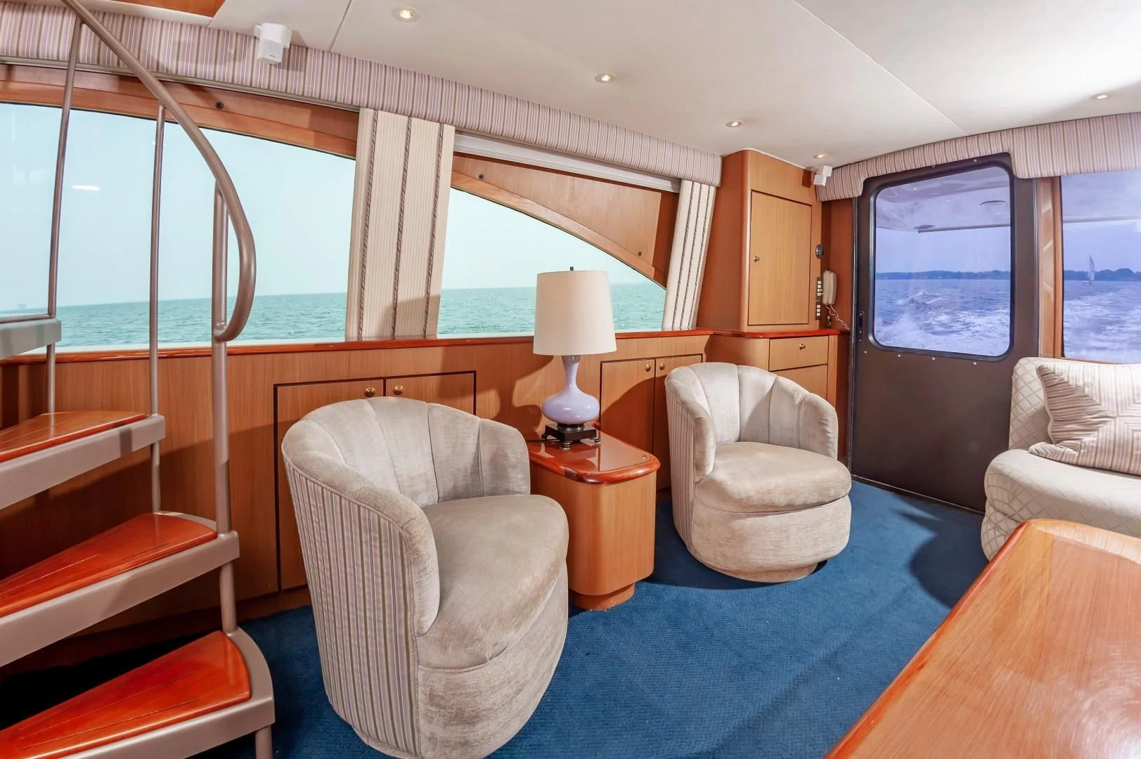 a living room with a large window aboard DOG HOUSE Yacht for Sale