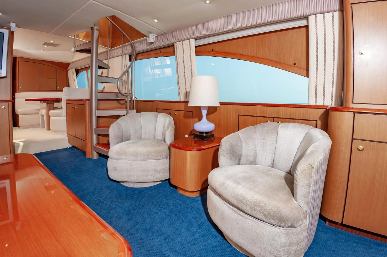 a living room with a staircase aboard DOG HOUSE Yacht for Sale