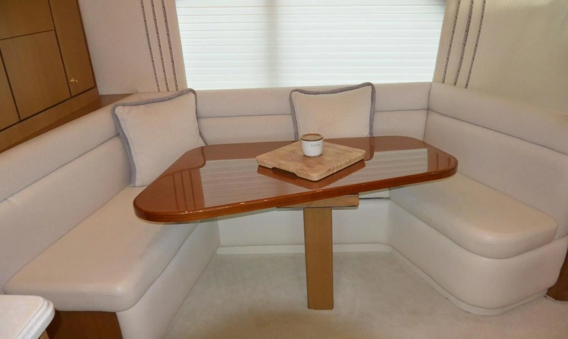 a coffee table with a chair aboard DOG HOUSE Yacht for Sale