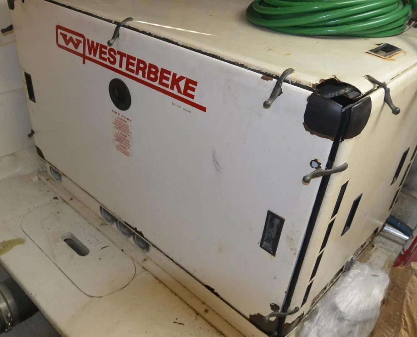 a white machine with a red label aboard DOG HOUSE Yacht for Sale