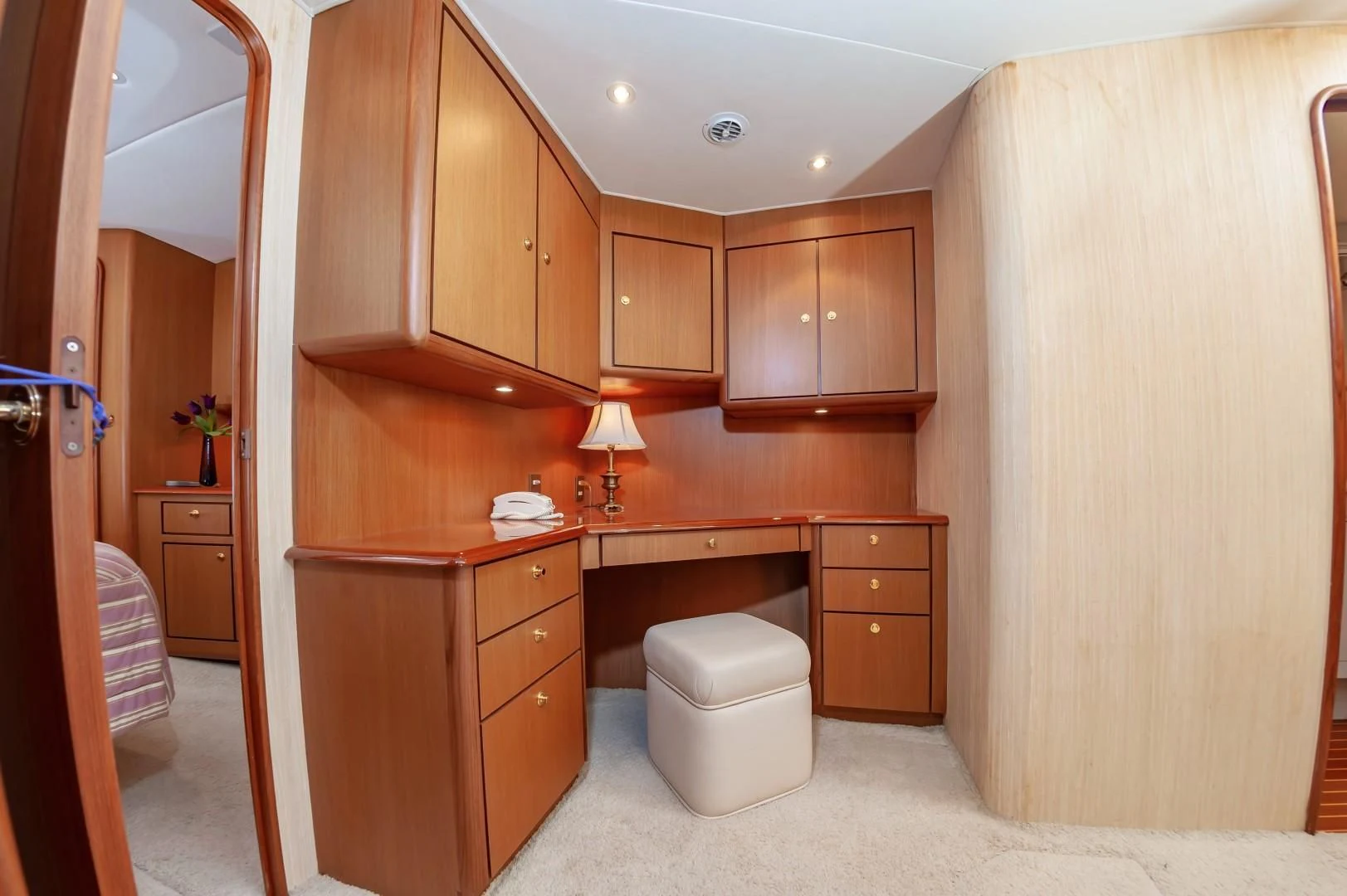 a bathroom with wooden cabinets aboard DOG HOUSE Yacht for Sale