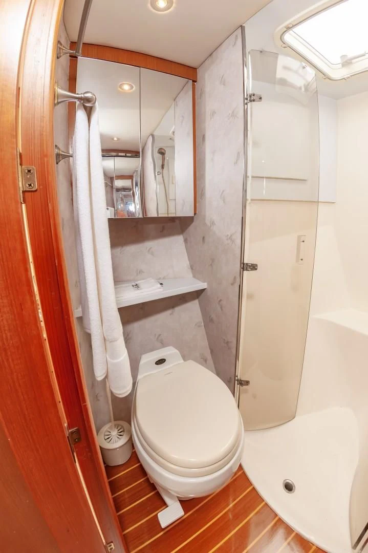 a bathroom with a toilet and sink aboard DOG HOUSE Yacht for Sale