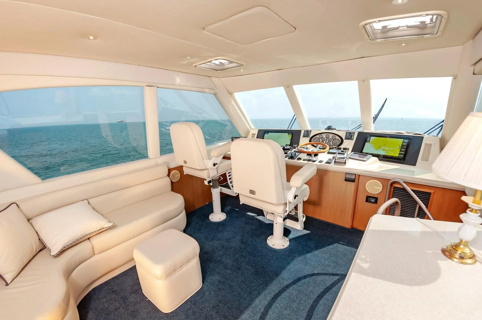 a room with a couch and a desk with a computer aboard DOG HOUSE Yacht for Sale