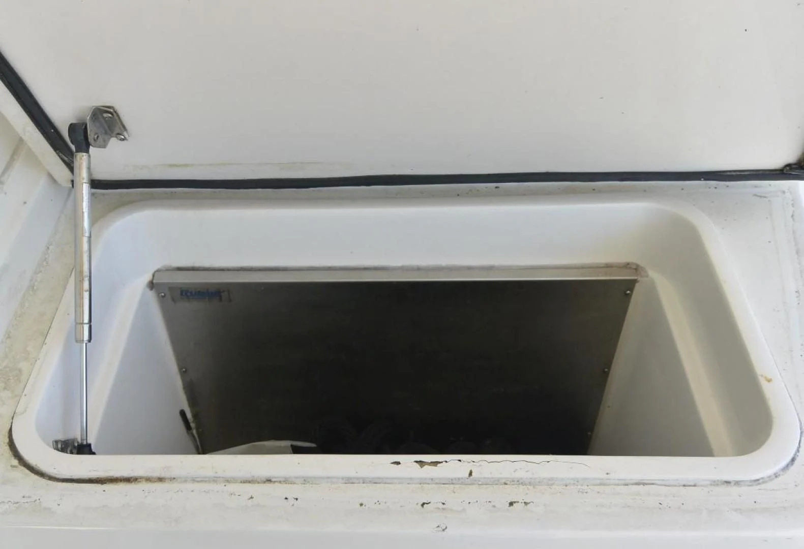 a white rectangular object with a black handle aboard DOG HOUSE Yacht for Sale