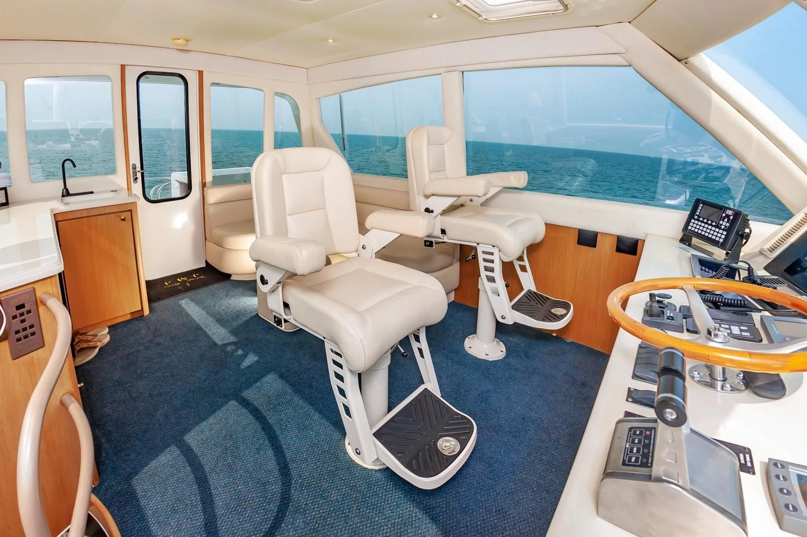 a room with a pool table and chairs aboard DOG HOUSE Yacht for Sale