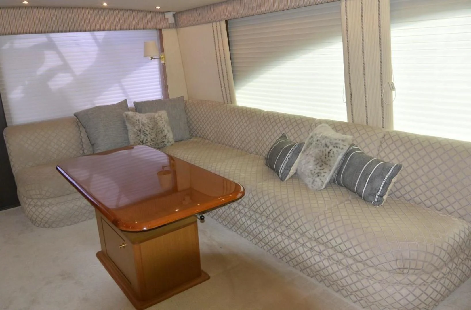 a couch with a coffee table aboard DOG HOUSE Yacht for Sale