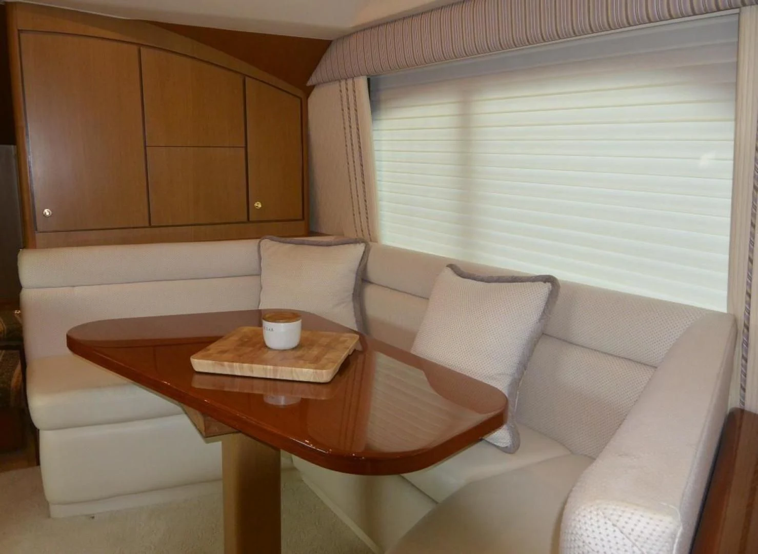 a room with a couch and coffee table aboard DOG HOUSE Yacht for Sale