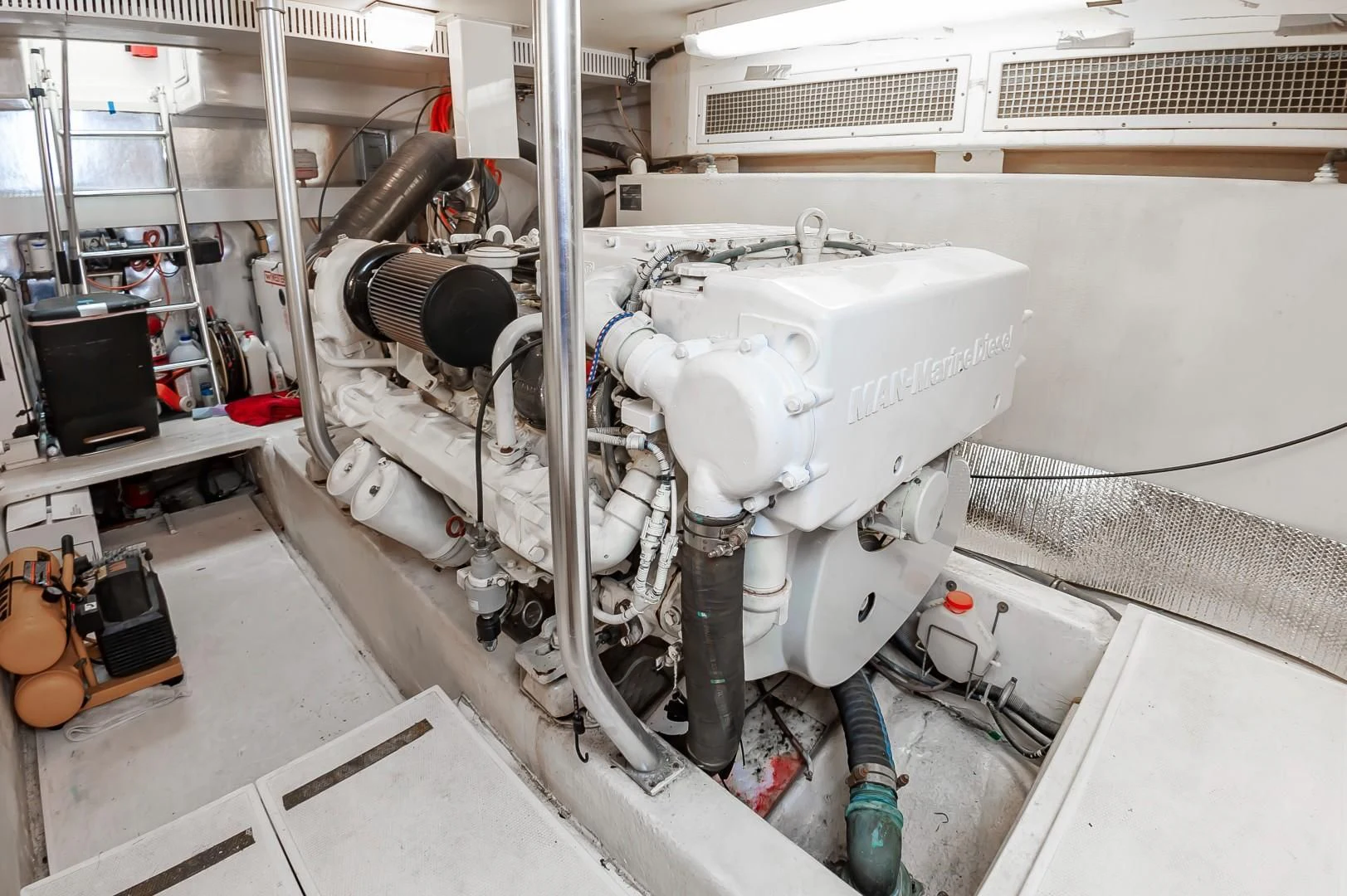 a machine with a large metal cylinder aboard DOG HOUSE Yacht for Sale