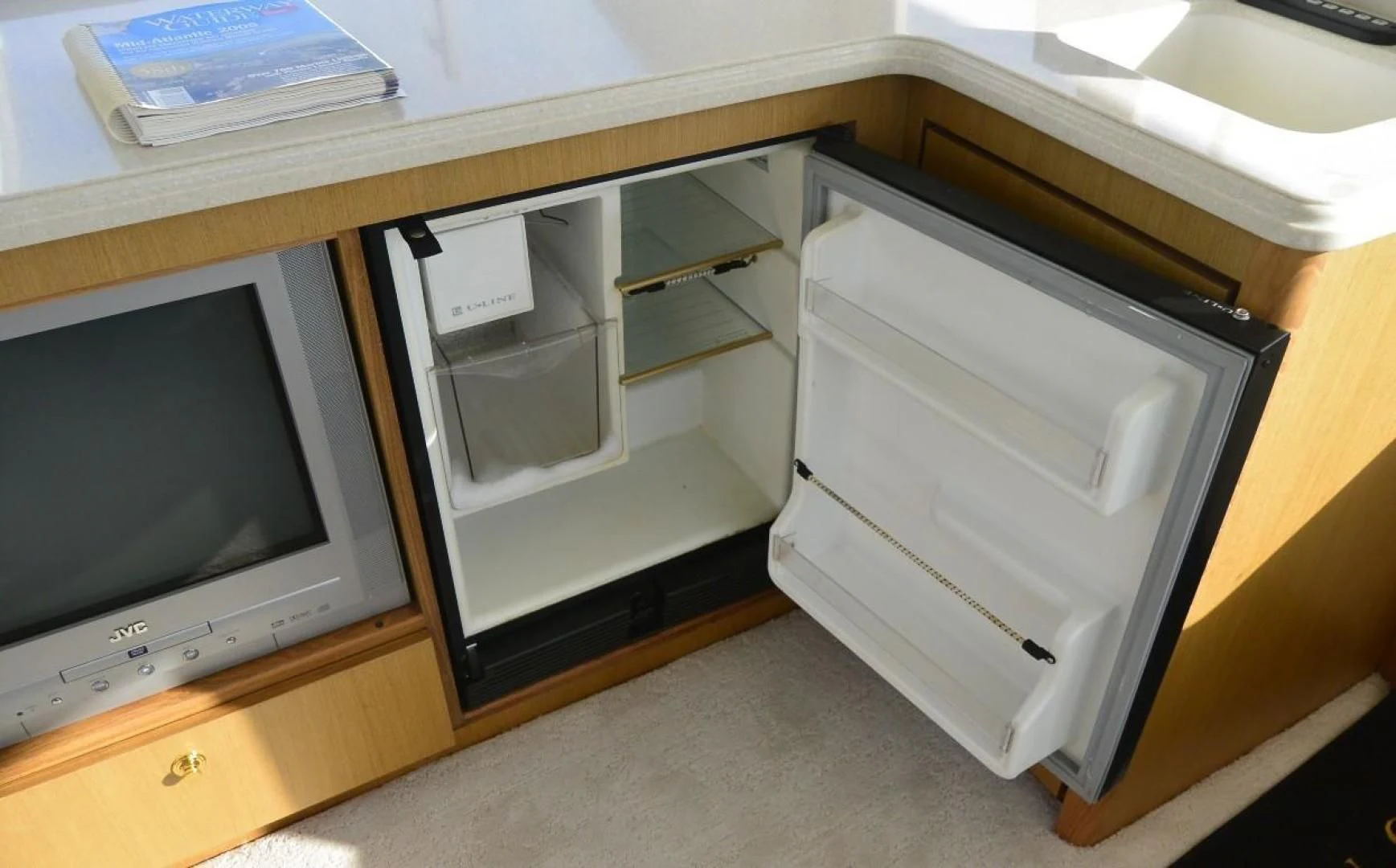 a computer and a television aboard DOG HOUSE Yacht for Sale