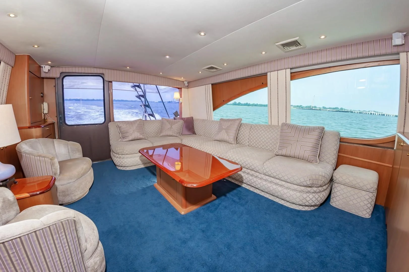 a living room with a large window aboard DOG HOUSE Yacht for Sale
