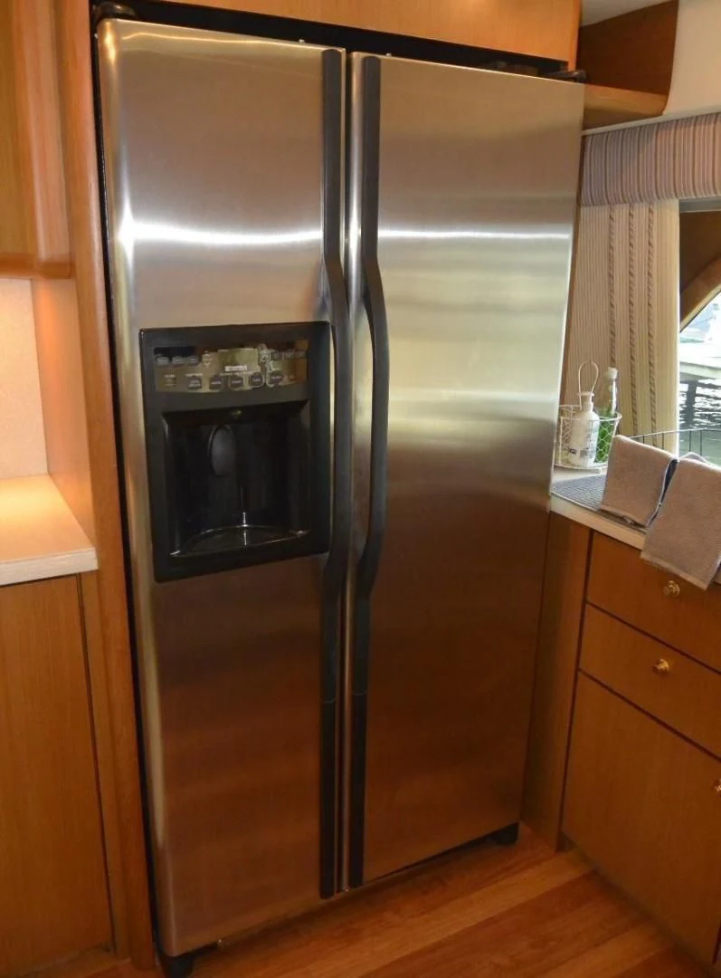a stainless steel refrigerator aboard DOG HOUSE Yacht for Sale