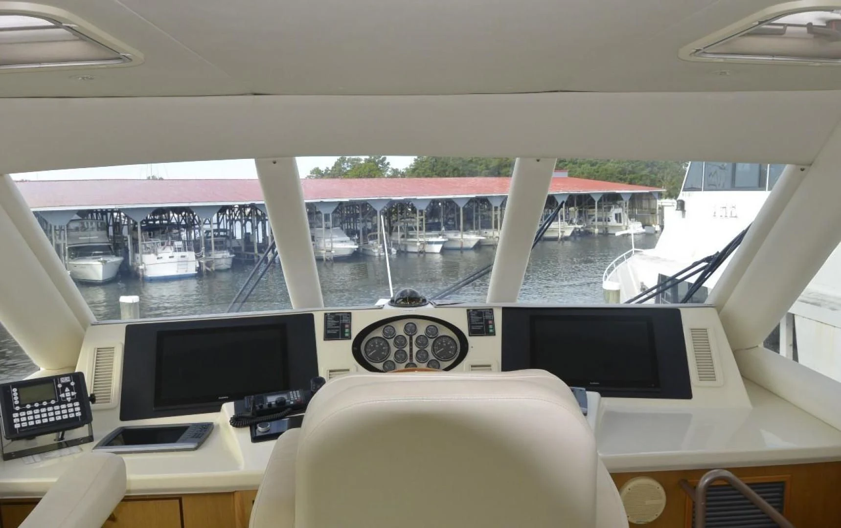 a room with a large window and a view of a city aboard DOG HOUSE Yacht for Sale