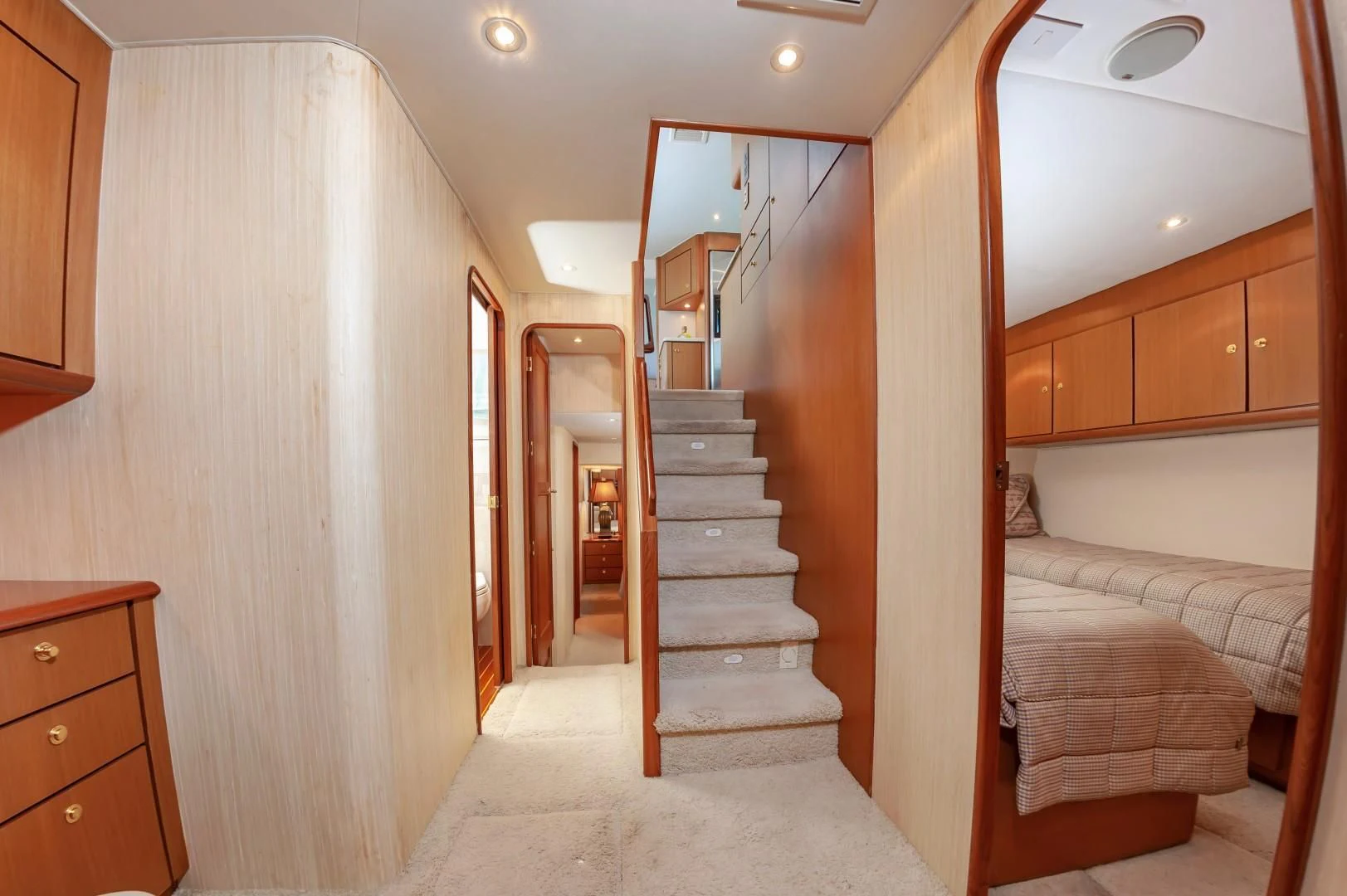 a room with a bed and a staircase aboard DOG HOUSE Yacht for Sale