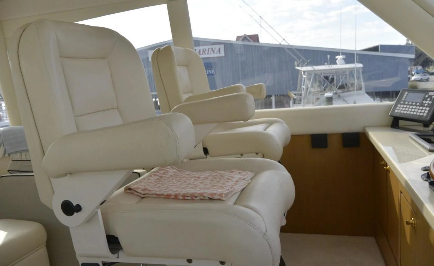 a white couch in a room aboard DOG HOUSE Yacht for Sale