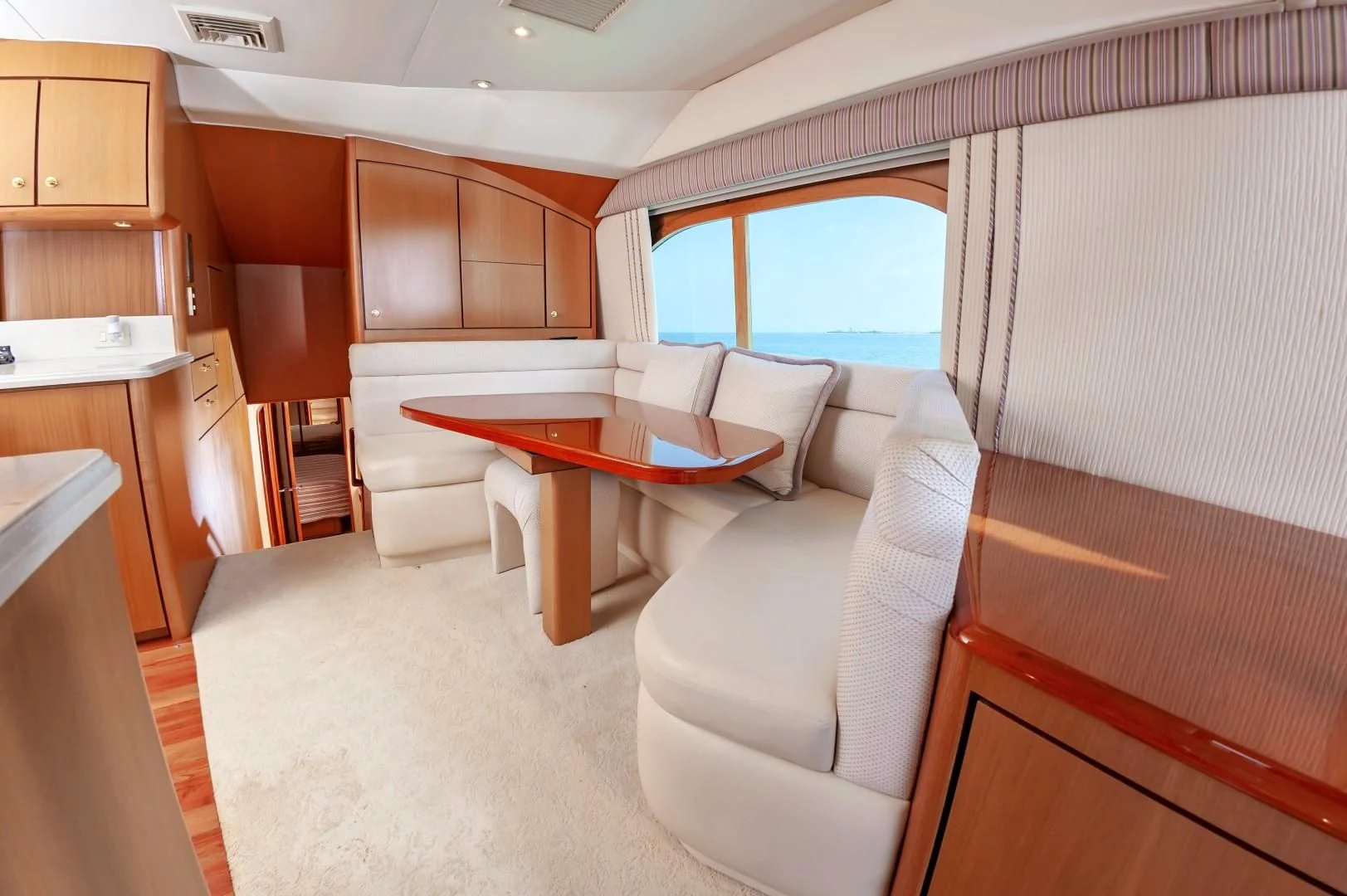 a living room with a couch and a table aboard DOG HOUSE Yacht for Sale