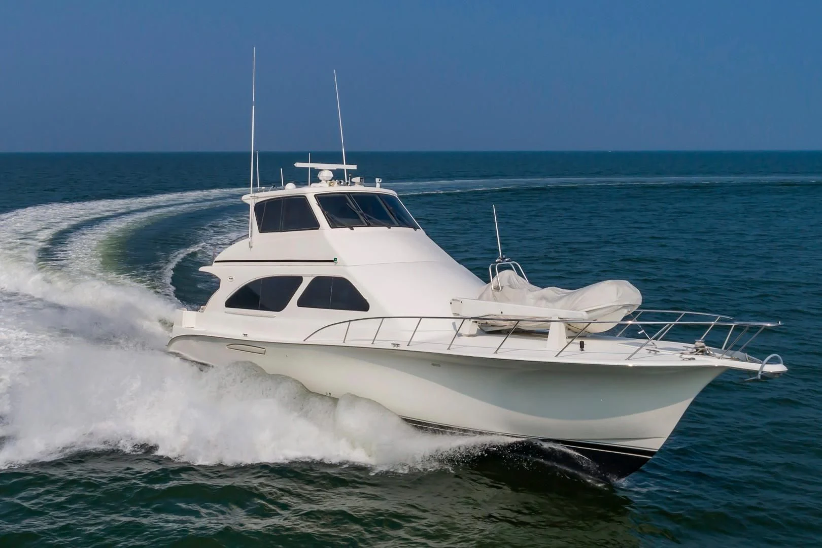 a white yacht in the water aboard DOG HOUSE Yacht for Sale