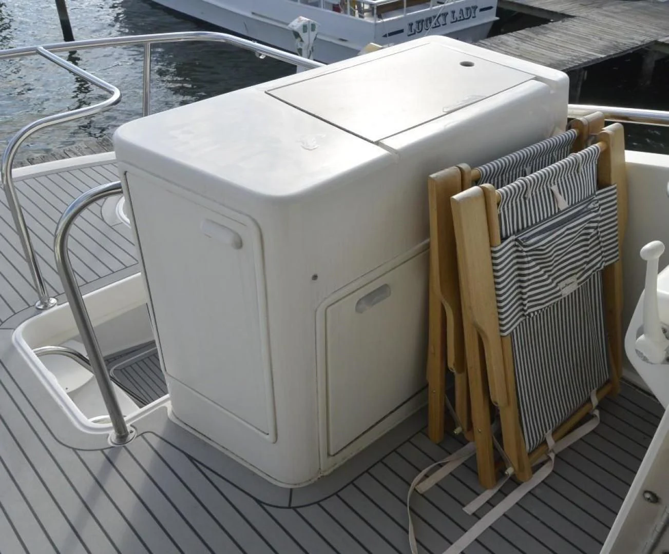 a white rectangular object with a wire on a wooden surface aboard DOG HOUSE Yacht for Sale