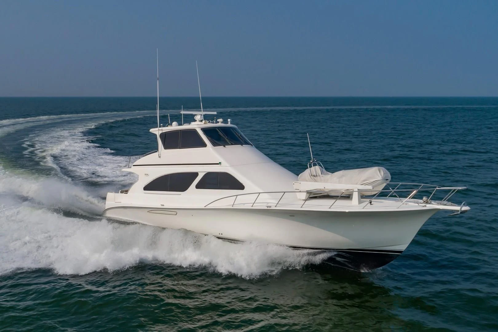 a white yacht in the water aboard DOG HOUSE Yacht for Sale