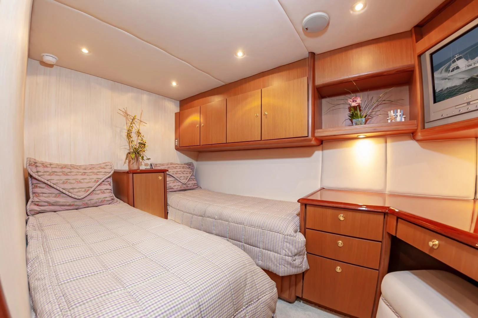 a bedroom with two beds aboard DOG HOUSE Yacht for Sale