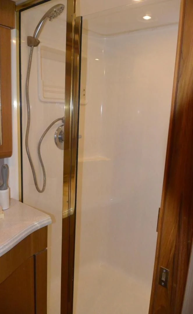 a shower unit with a glass door aboard DOG HOUSE Yacht for Sale