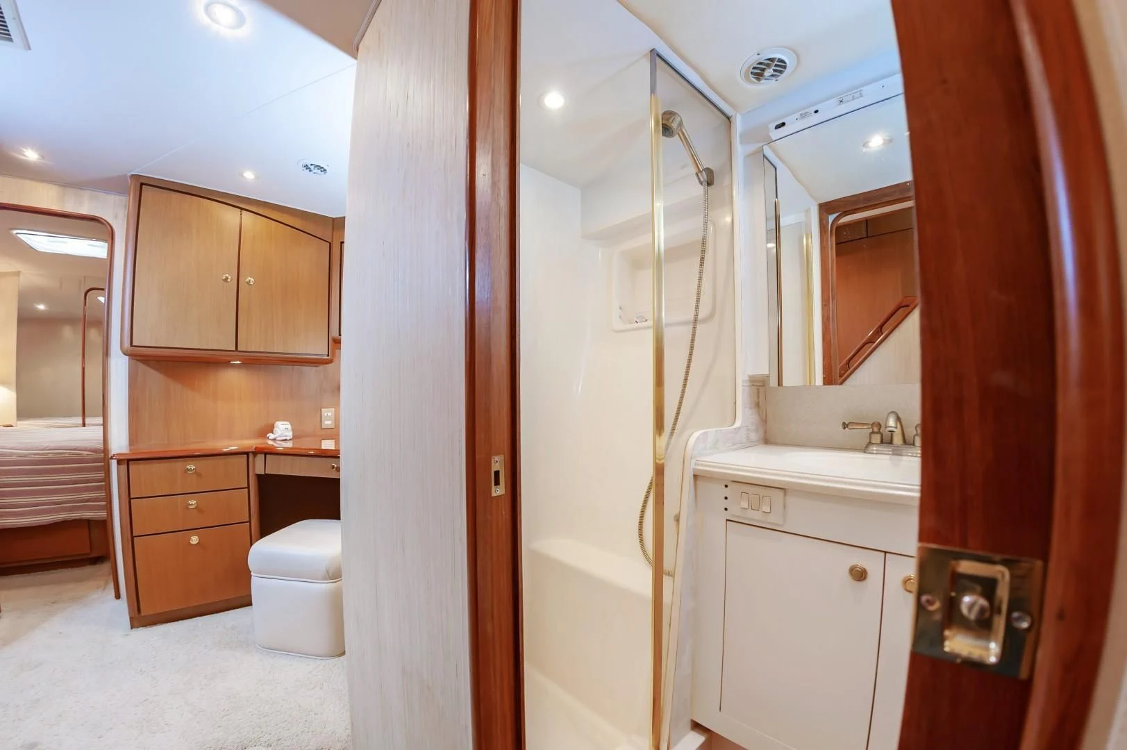 a bathroom with a shower unit and sink aboard DOG HOUSE Yacht for Sale