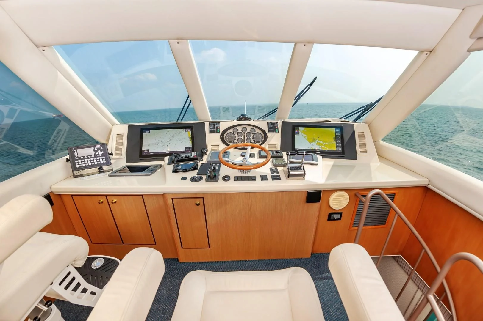 a room with a desk and a bed aboard DOG HOUSE Yacht for Sale