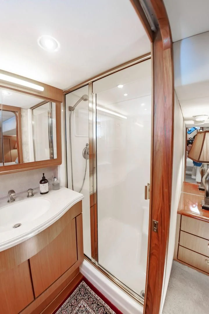 a bathroom with a shower and sink aboard DOG HOUSE Yacht for Sale