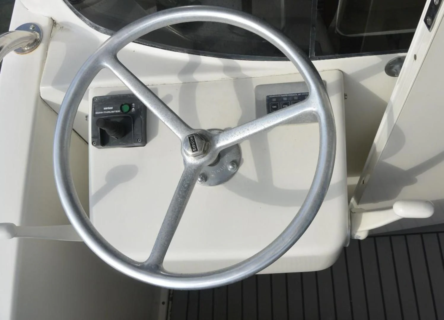 a close-up of a steering wheel aboard DOG HOUSE Yacht for Sale