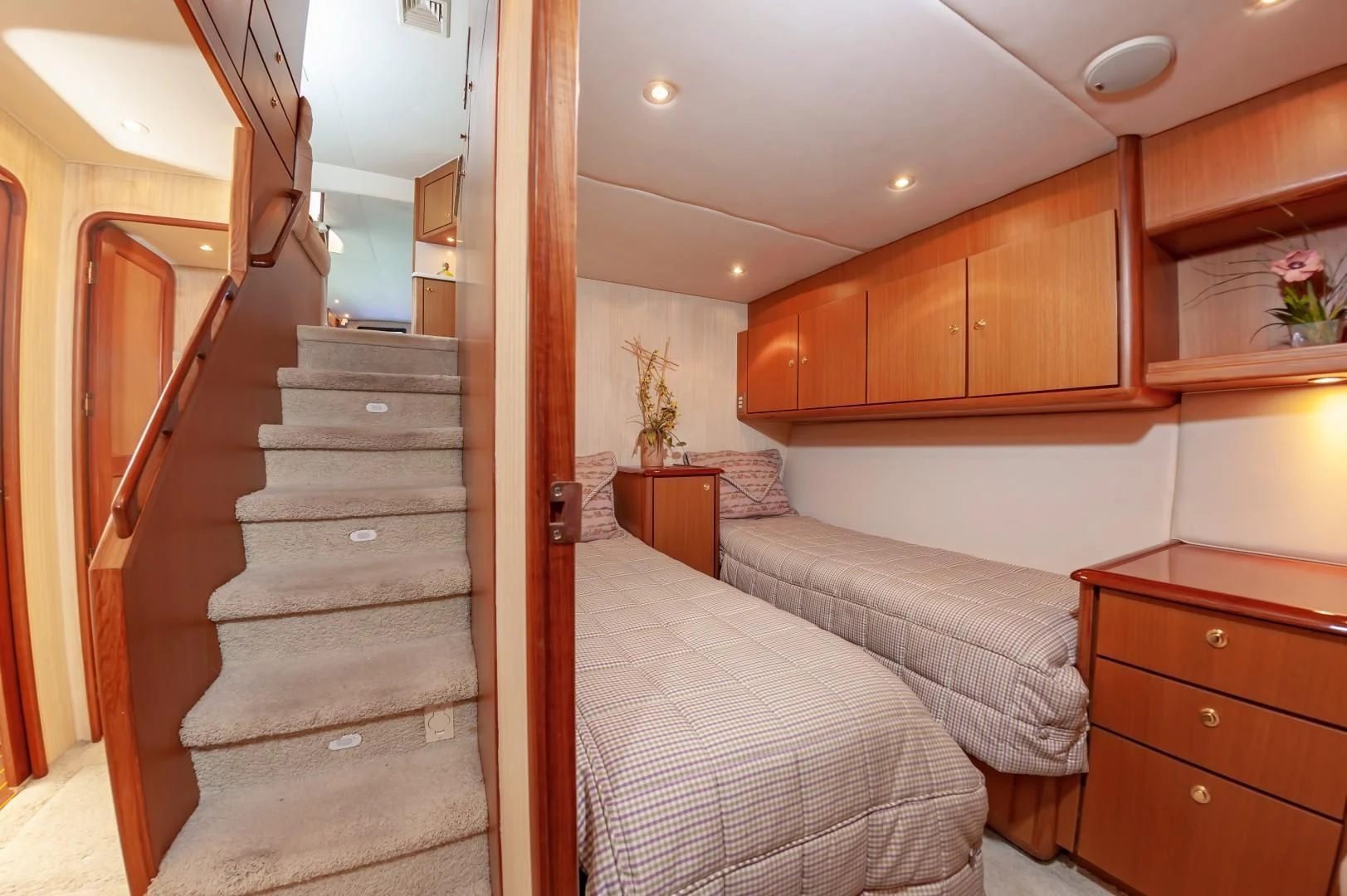 a wooden staircase in a bedroom aboard DOG HOUSE Yacht for Sale
