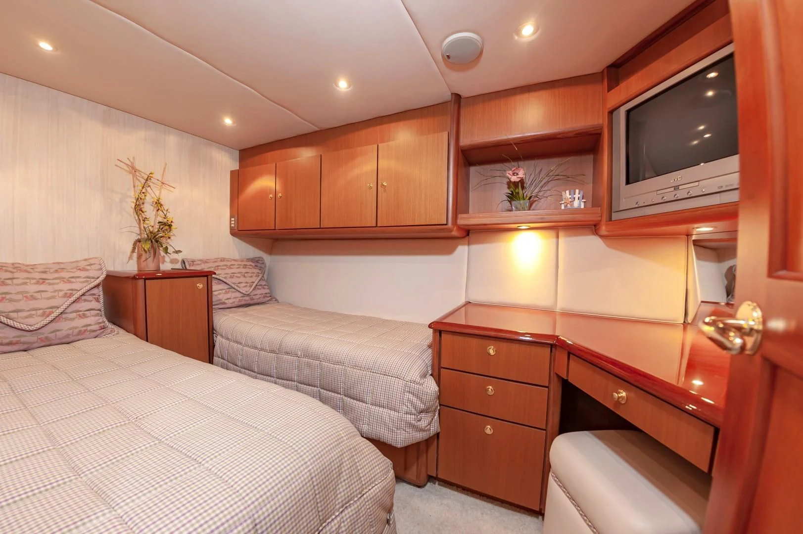 a bedroom with a bed and a television aboard DOG HOUSE Yacht for Sale