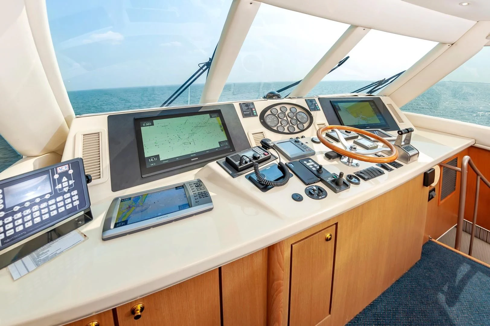 a desk with a laptop and a monitor on it aboard DOG HOUSE Yacht for Sale