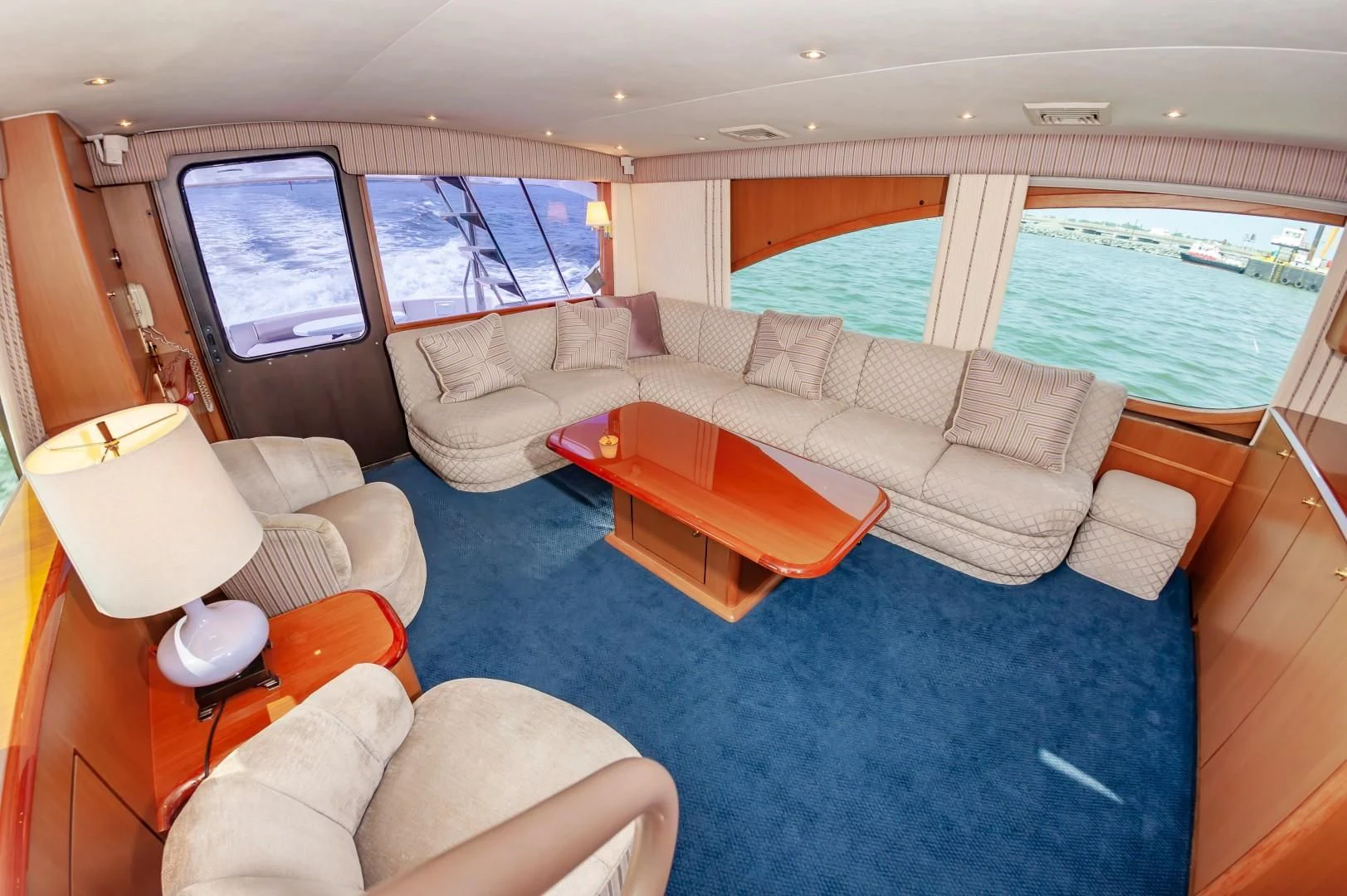 a living room with a couch and a table aboard DOG HOUSE Yacht for Sale