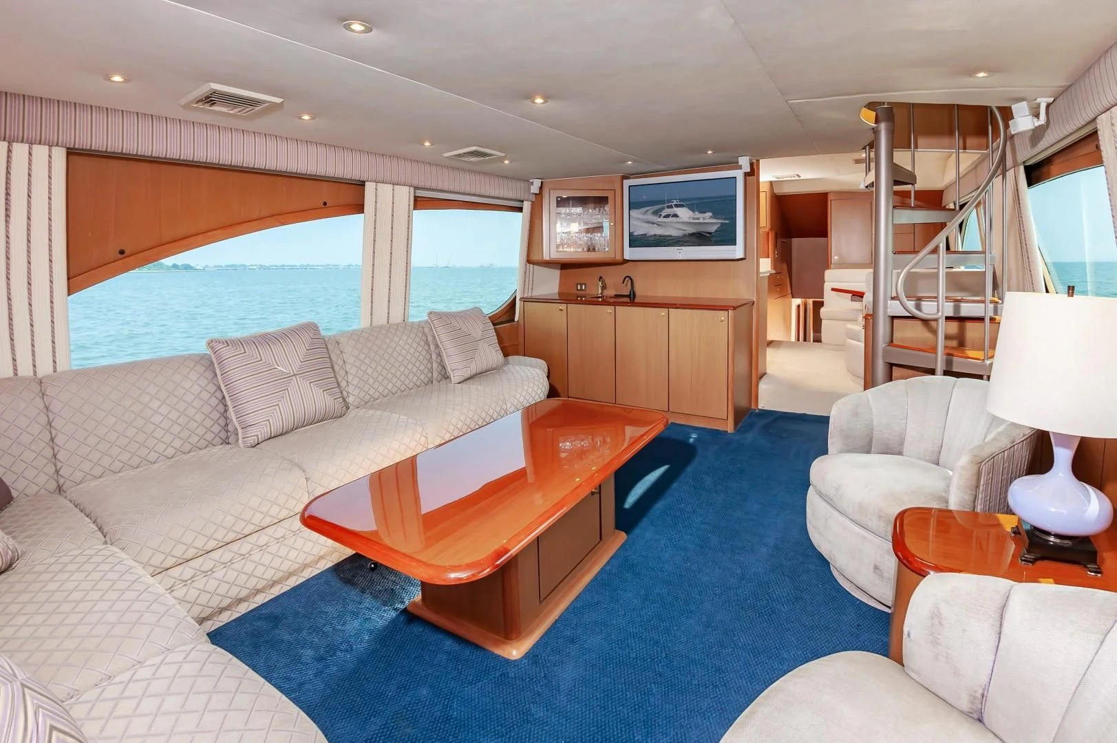 a living room with a large window aboard DOG HOUSE Yacht for Sale