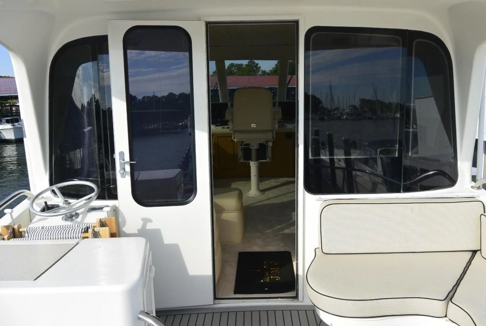 a couple of windows with doors open aboard DOG HOUSE Yacht for Sale