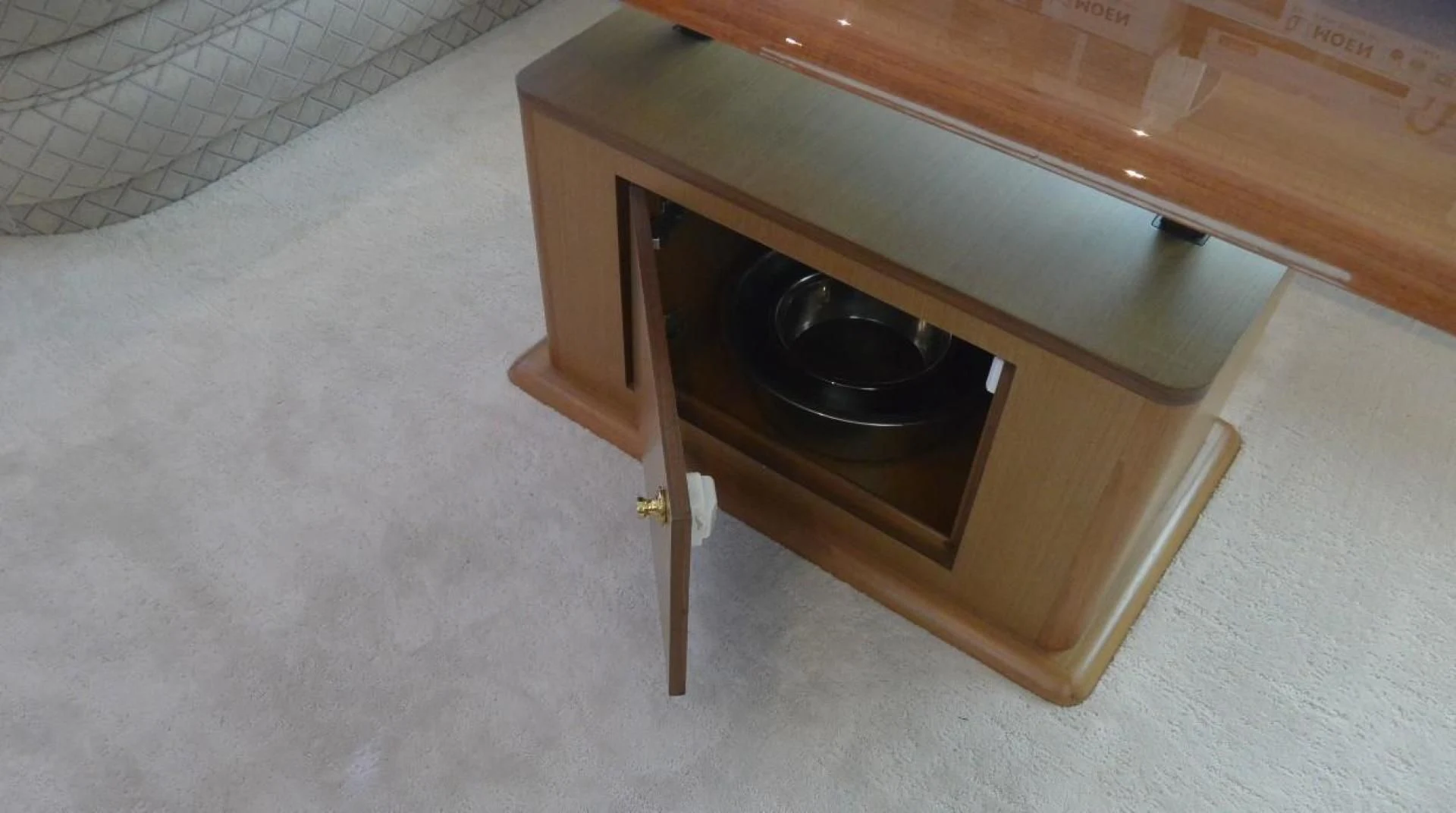 a wooden cabinet with a black pan on it aboard DOG HOUSE Yacht for Sale