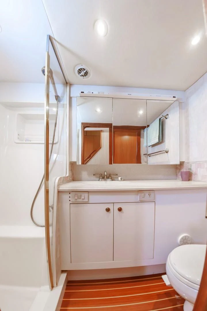 a bathroom with a shower unit aboard DOG HOUSE Yacht for Sale