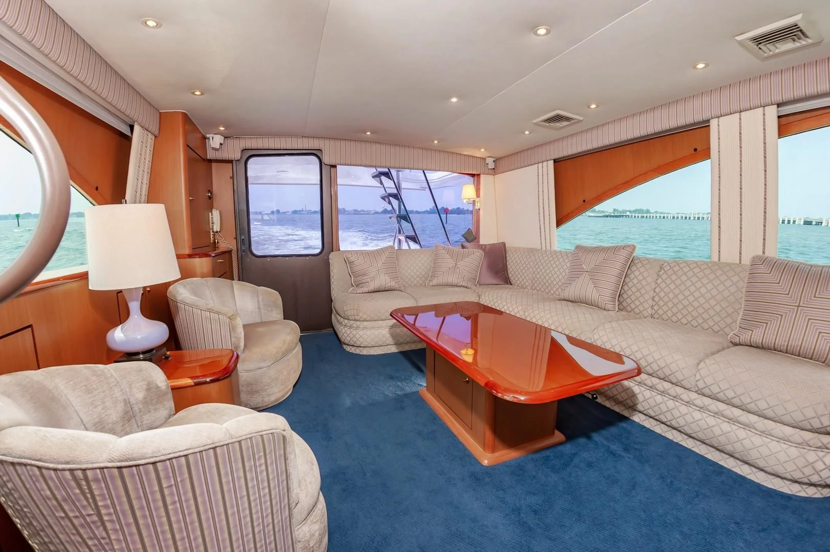 a living room with a couch and a table aboard DOG HOUSE Yacht for Sale